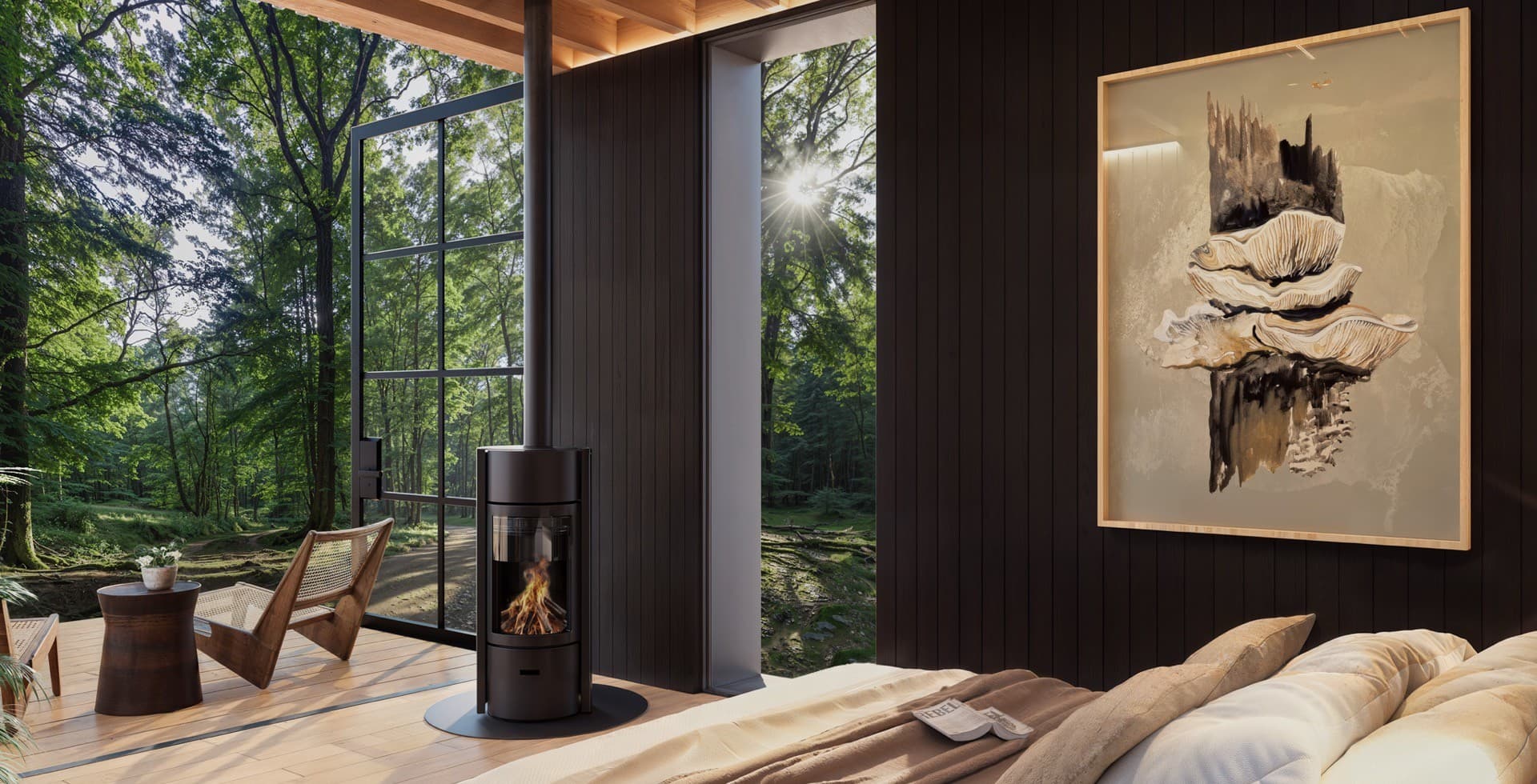 Inside an ELMNTL unit: the wood stove, the bed, and floor-to-ceiling forest